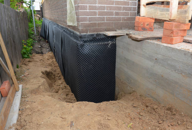 Happy homeowners after waterproofing job in Abrams